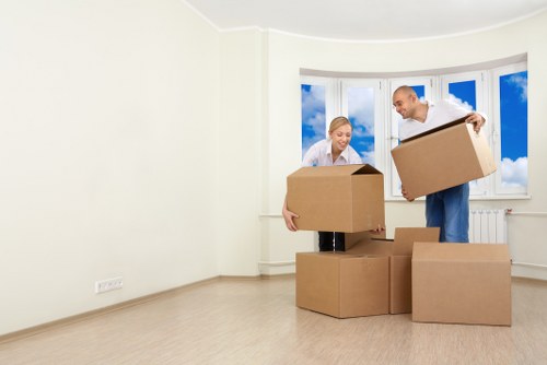 Professional movers carrying boxes for a Coventgarden student move