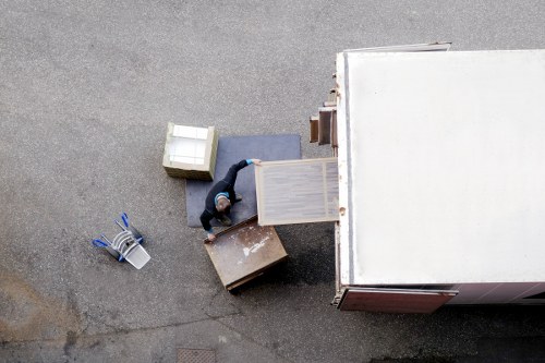 Team member using safe lifting practices during a move