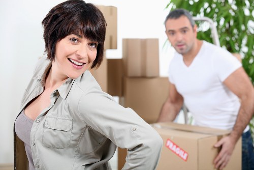 Professional man and van crew loading belongings safely for transport